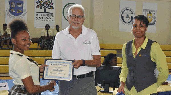 Don Stark (TCI Reef Fund) and Talisha (Fortis) present certificate to Elishah Sidnord, representing the Clement High School team.