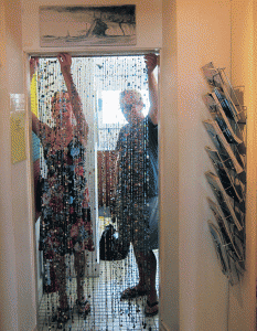 Old beads make a new curtain in the shop.